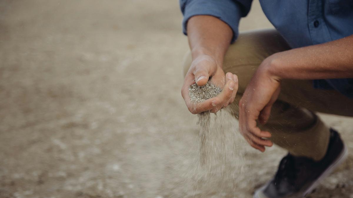 man holding sand